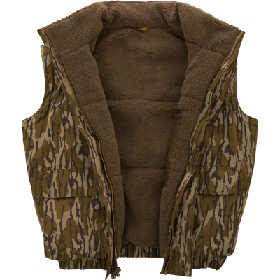 Throwback 80 Sport Vest with camouflage print, sherpa fleece lining, zip front, and snap-flap pockets, designed for outdoor adventures and maximum weather protection.