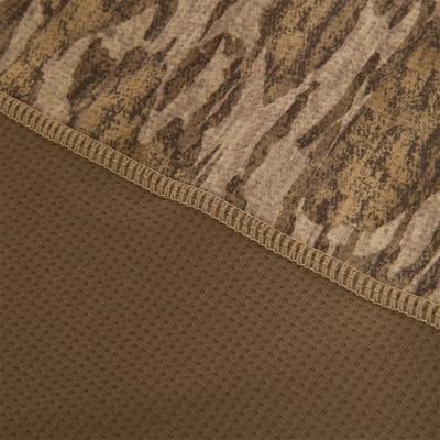 Close-up of the EST Offset 1.0 Half Zip Pullover, showing brown camouflage knit and perforated mesh fabric with overlock stitching for breathability and comfort.