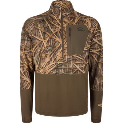 The Waterfowl EST Offset 1.0 Half Zip Pullover features Mossy Oak Original Shadow Grass camo, UPF30 protection, a chest zip pocket, partial front zip, and long sleeves for comfort and style.