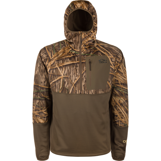 The Waterfowl MST Offset 2.0 Half Zip Hoodie in Mossy Oak Original Shadow Grass offers UPF50, moisture-wicking fabric, a chest pocket, and features grass camo on top with a solid brown bottom.