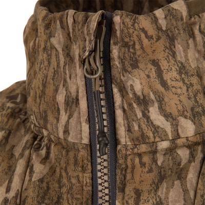 Close-up of the LST BMF Vest with Primaloft, showcasing the camo-patterned front zipper and hood area, highlighting its windproof and water-resistant features.