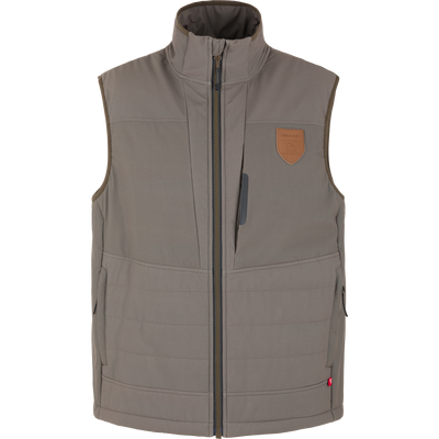 Mud brown Drake X Ducks Unlimited LST BMF Vest with Primaloft insulation, featuring a full-length front zipper, chest pocket, and a leather-look patch on the upper left chest.