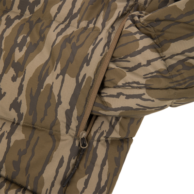 Camouflage-patterned BMF Down Jacket with tiger-stripe print, quilted baffles, zipper pull cord, and pocket, designed for warmth and durability in demanding hunting conditions.