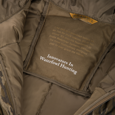 BMF Down Jacket's interior with label and text, showcasing its premium insulation and functional design for demanding hunts.
