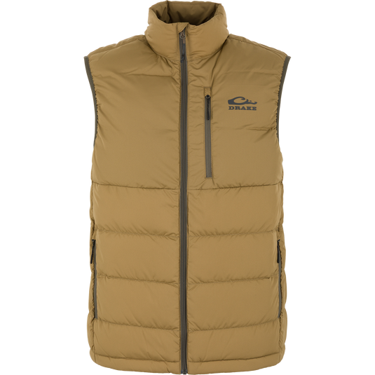 The BMF Insulated Down Vest by Waterfowl in Field Khaki features a high collar, front zipper, two side pockets, and a chest pocket. Lightweight and sleeveless with the Drake logo on the left chest. Shown on a white background.