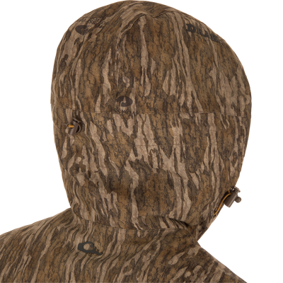 LST BMF Eqwader Full Zip with Primaloft hood close-up, featuring brown and tan camo pattern, adjustable draw-cord toggles, and sherpa fleece lining for warmth.