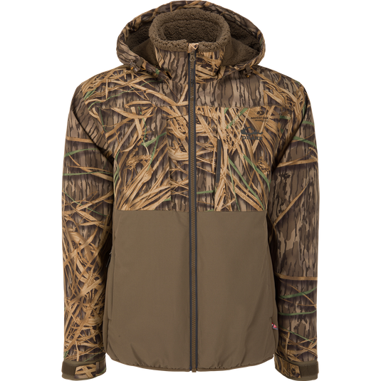 The LST BMF Eqwader Full Zip Jacket with Primaloft by Waterfowl features a camo hood, brown grass-patterned upper, and solid olive lower—perfect for outdoor adventures.