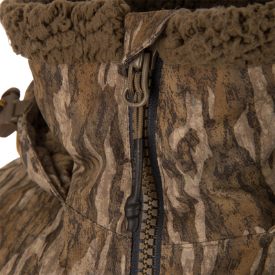 LST BMF Eqwader Half Zip Jacket with Primaloft, featuring a camo pattern, heavy-duty zipper with corded pull tab, and fleece-lined collar for warmth and durability.