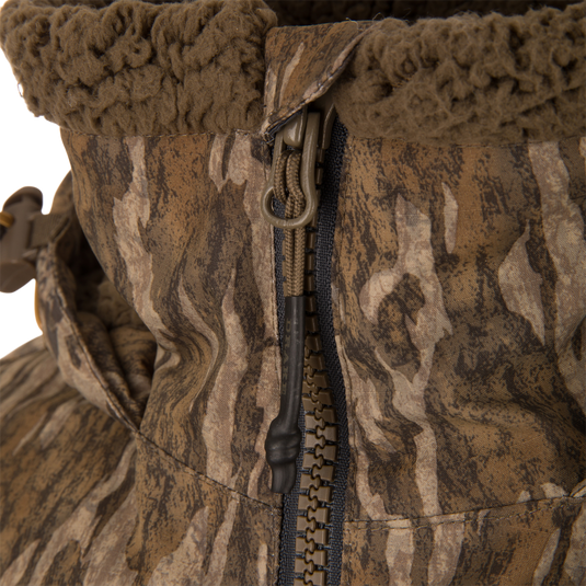 LST BMF Eqwader Half Zip Jacket with Primaloft, featuring a camo pattern, heavy-duty zipper with corded pull tab, and fleece-lined collar for warmth and durability.