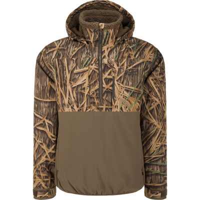 The Waterfowl LST BMF Eqwader Half Zip Jacket with Primaloft in Mossy Oak Original Shadow Grass features a camo ripstop upper and solid olive lower, designed for outdoor and hunting use.
