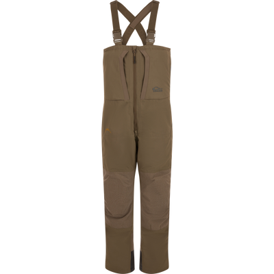 The Waterfowl LST BMF Pit Bib with Primaloft features a waterproof, abrasion-resistant design, adjustable suspenders, front zip, reinforced knees, and dual chest pockets—perfect for fishing or hunting. Plain white background.