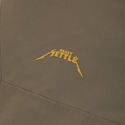 Olive green Drake X Ducks Unlimited LST BMF Pit Bib with Primaloft featuring a yellow graphic that says HEAVY METTLE in a stylized font.