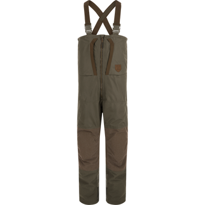 Mud brown Drake X Ducks Unlimited LST BMF Pit Bib with Primaloft insulated hunting overalls with adjustable shoulder straps and a front zipper.