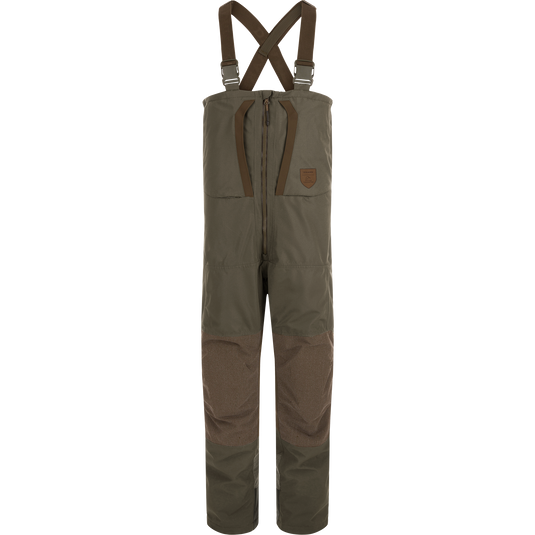 Mud brown Drake X Ducks Unlimited LST BMF Pit Bib with Primaloft insulated hunting overalls with adjustable shoulder straps and a front zipper.