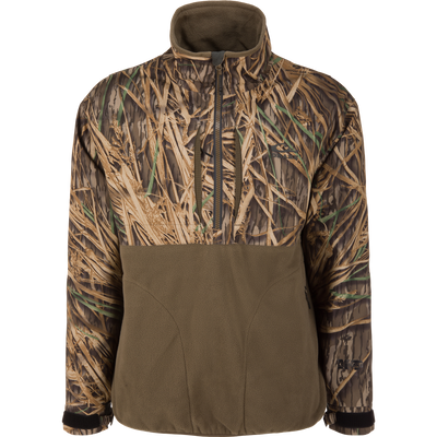 The Waterfowl MST CommandXT Eqwader Half Zip Jacket features windproof fabric, a high collar, Mossy Oak Original Shadow Grass camo on top, and solid olive green fleece on the front pouch.