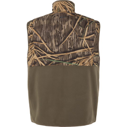 The CommandXT Eqwader Vest by Waterfowl is a sleeveless, abrasion-resistant vest with a camo upper half and solid olive green fleece lower half, shown from the back on a white background.