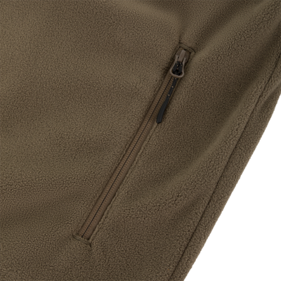 Close-up of the Waterfowl CommandXT Eqwader Vest, featuring a soft brown fleece texture, black pull tab, and vertical zipper pocket. Comfort and detail are highlighted with an angled view.