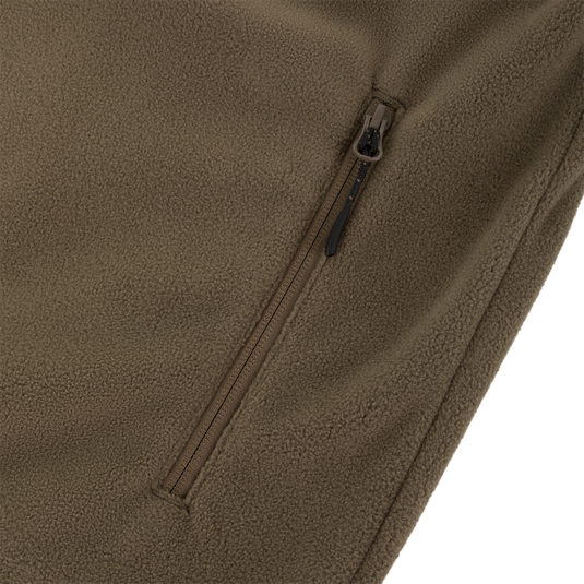 Close-up of the Waterfowl CommandXT Eqwader Vest, featuring a soft brown fleece texture, black pull tab, and vertical zipper pocket. Comfort and detail are highlighted with an angled view.