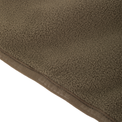 Close-up of Waterfowl CommandXT Eqwader Vest fabric, showcasing its soft, textured brown fleece and stitched edge.