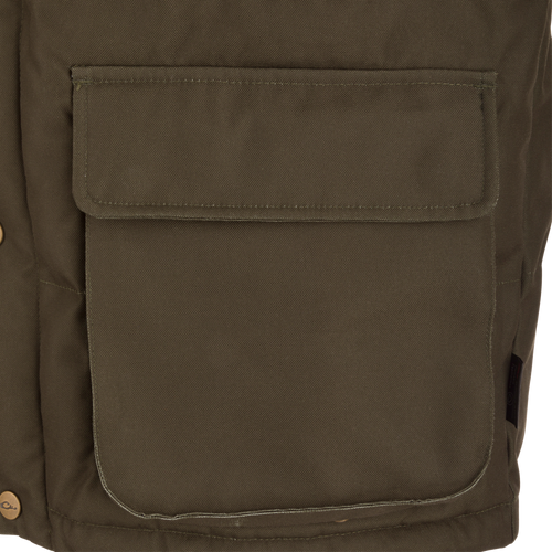 Close-up of the Throwback 80 Featherless Puffer Jacket's olive-green canvas front pocket with flap and snap-button, showcasing its durable and functional design.