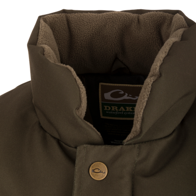 Close-up of the Throwback 80 Featherless Puffer Vest, highlighting its waterproof, windproof polyester fabric and large pockets, ideal for hunting and outdoor activities.