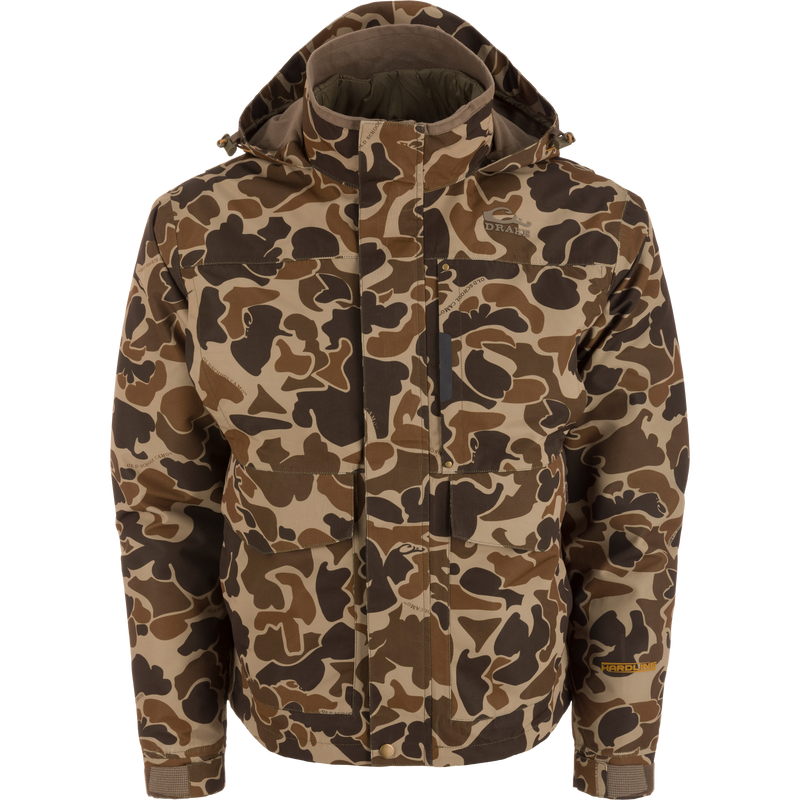 LST Hardline 3-in-1 Jacket with camo pattern, hood, and Drake embroidery, features snap front, multiple pockets, adjustable cuffs, and ergonomic fit for adaptable weather protection.