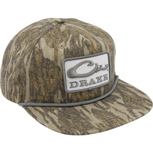 Drake X LOST Goat Rope Cap featuring a camouflage pattern, flat brim, snap-back closure, and a stylized Drake logo with rope detail above the bill.
