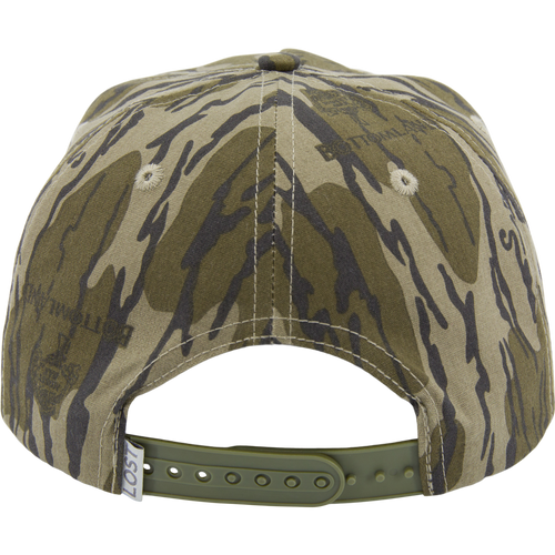 Drake X LOST Goat Rope Cap in tiger-stripe camouflage, features snapback closure, paracord detail, and ventilation eyelets, blending rugged style with functionality.