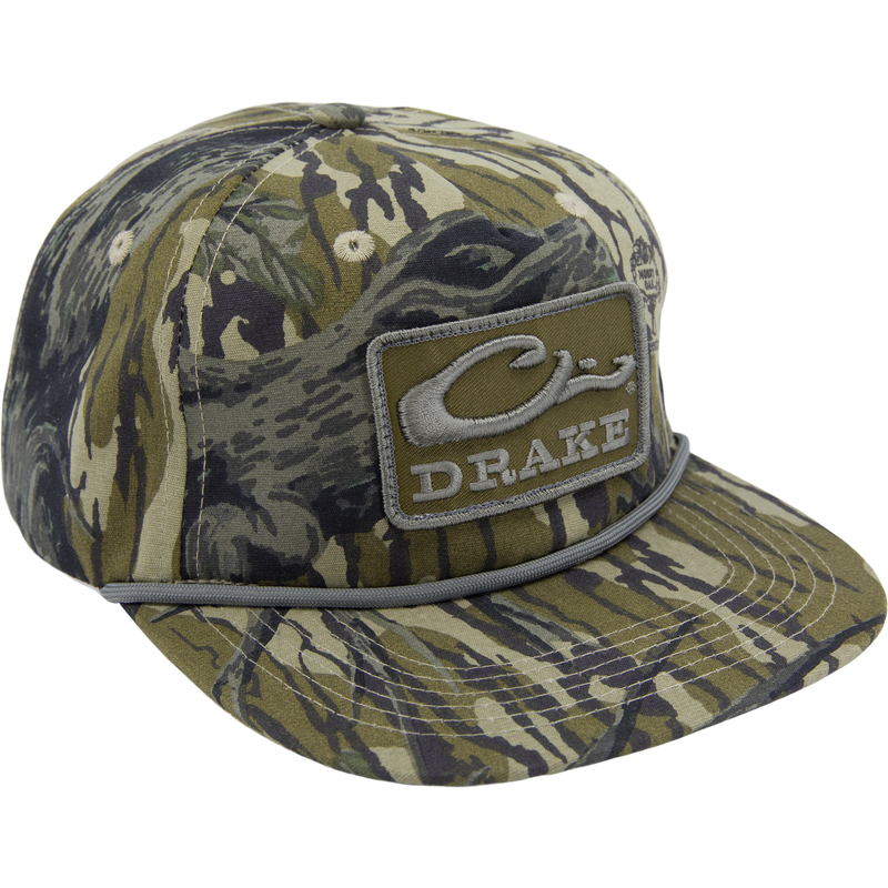 Drake X Lost Hat Goat Rope Cap featuring a camo pattern, stylized DRAKE patch, and paracord rope detail, offering rugged style and customizable fit.