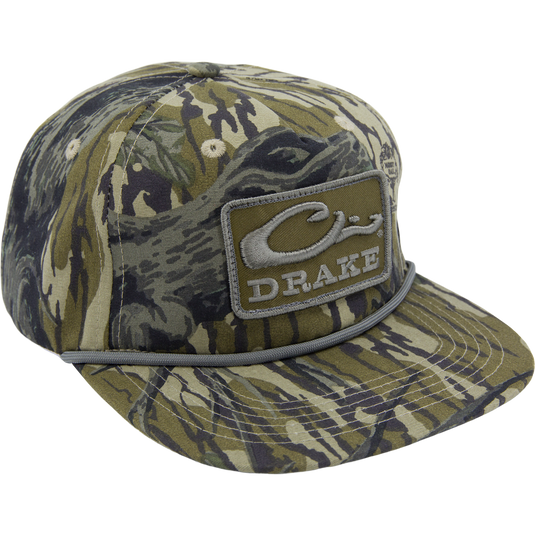 Drake X Lost Hat Goat Rope Cap featuring a camo pattern, stylized DRAKE patch, and paracord rope detail, offering rugged style and customizable fit.