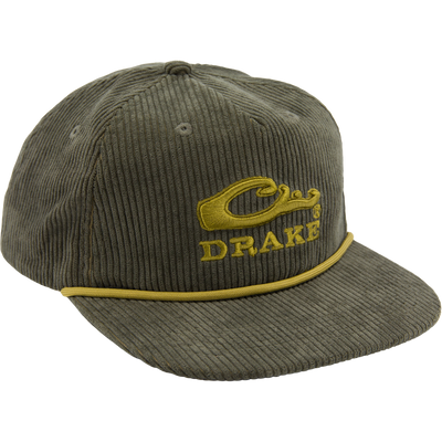 Drake X Lost Hat Goat Rope Corduroy Cap features an olive-green five-panel design, mustard-yellow Drake logo, and rugged paracord detail, offering stylish, versatile outdoor flair.