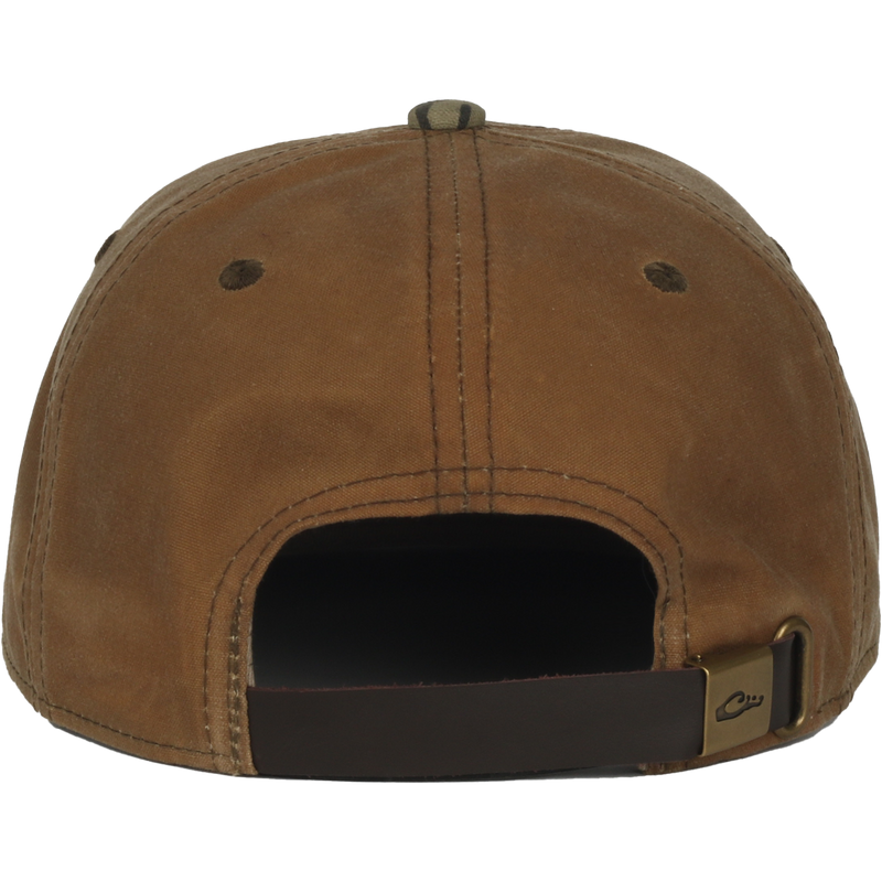 Back view of the Waxed Flatbill Ball Cap, showcasing its unstructured design, adjustable leather strap, and waxed canvas fabric for a stylish, comfortable fit.