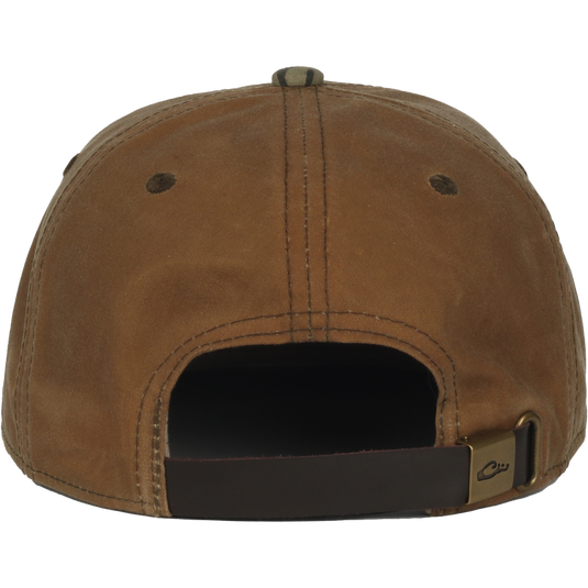 Back view of the Waxed Flatbill Ball Cap, showcasing its unstructured design, adjustable leather strap, and waxed canvas fabric for a stylish, comfortable fit.