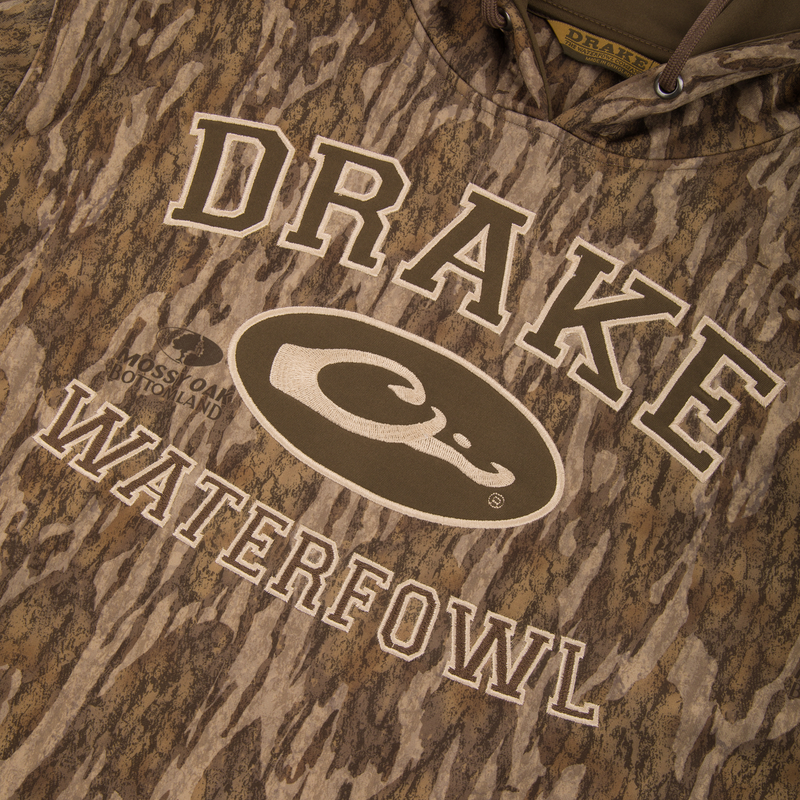 Performance Hoodie with anti-pilling outer shell, kangaroo pocket, and adjustable lined hood, designed for comfort and durability, ideal for layering or standalone wear.