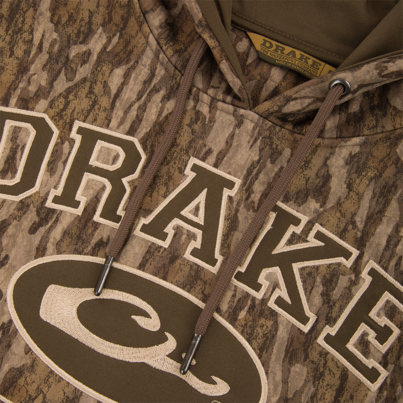 Performance Hoodie featuring an anti-pilling outer shell, lined hood with drawstring, kangaroo pocket, and built-in stretch, ideal for versatile comfort and durability.
