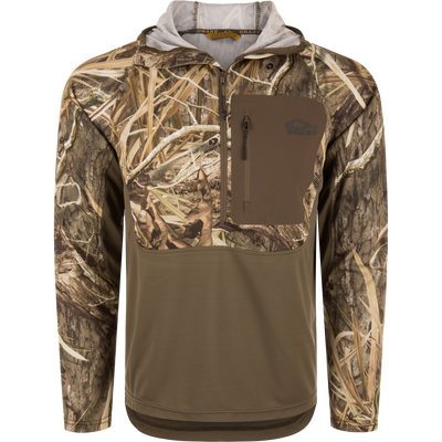 The Waterfowl EST Performance Half-Zip Hoodie in Mossy Oak Shadow Grass Habitat is water resistant, features UPF30 protection and a chest pocket—ideal for outdoor or hunting use.