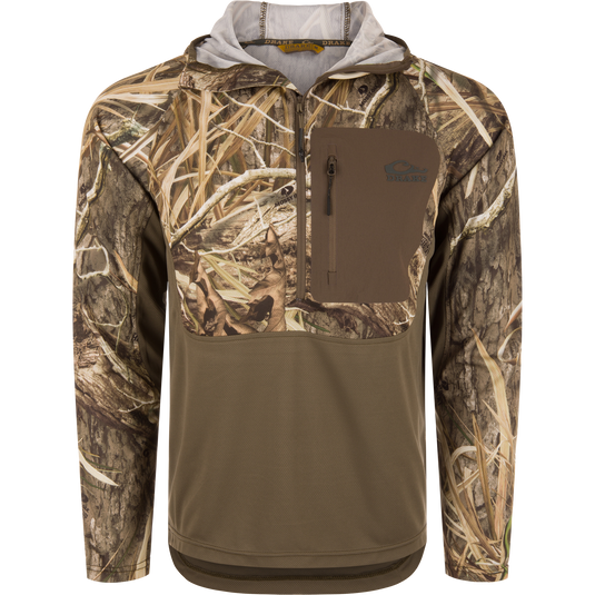 The Waterfowl EST Performance Half-Zip Hoodie in Mossy Oak Shadow Grass Habitat is water resistant, features UPF30 protection and a chest pocket—ideal for outdoor or hunting use.