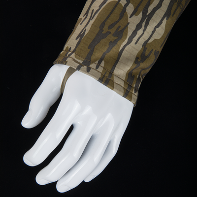 Mannequin hand in a Grid Fleece Half Zip Hoodie with tiger-stripe camo sleeve and thumb hole, showcasing water-resistant YKK zippered chest pocket and soft fleece lining.