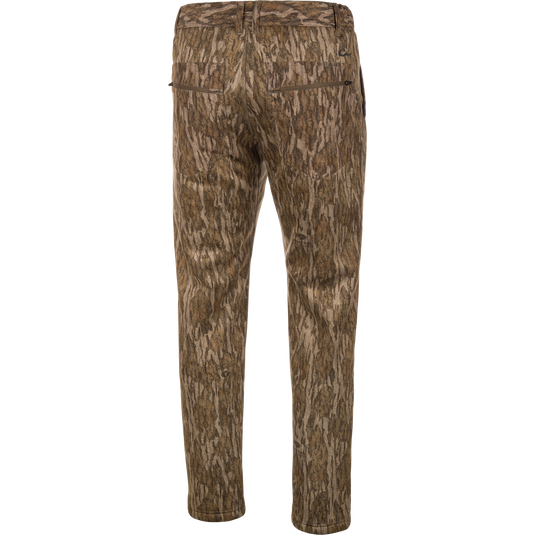 Back view of the BMF Ultimate Wader Pants in brown camo by Waterfowl, with two rear pockets, straight leg design, and warm Sherpa fleece lining, shown on a plain white background.