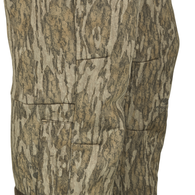 MST Ultimate Wader Pants displaying adjustable ankle zippers and side-elastic waist, ideal for comfort under waders or casual use, embodying Drake Waterfowl's commitment to versatile hunting apparel.