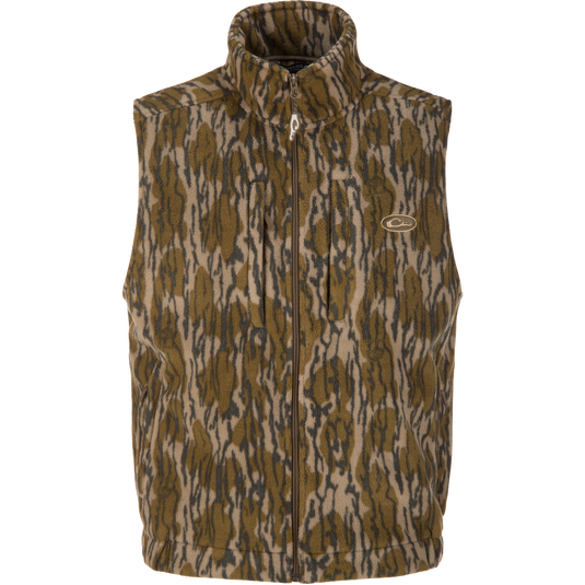 The MST Windproof Layering Vest by Lifestyle is a sleeveless, zip-up layering vest in brown, tan, and black camo with water-resistant fleece and a small embroidered chest logo.