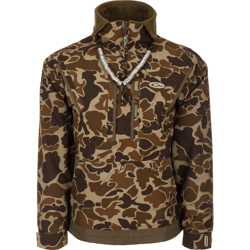 MST Waterproof Fleece-Lined Quarter Zip Jacket in camouflage with high collar, chest pockets, kangaroo pouch, and adjustable cuffs, ideal for mid-season hunting.