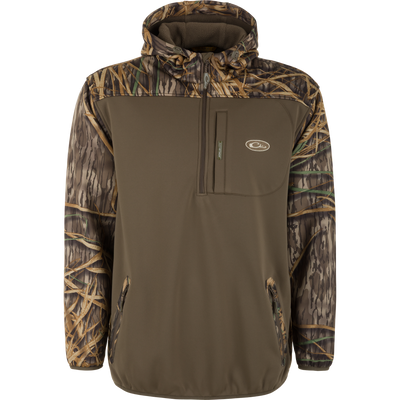 The Waterfowl MST Endurance Soft Shell Hoodie is a brown, hooded pullover with fleece-lined hood, chest pocket, and camouflage accents on the hood, shoulders, and sleeves, shown on a plain white background.