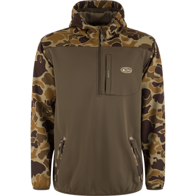 The Waterfowl MST Endurance Soft Shell Hoodie features a brown body with camouflage sleeves, hood, and shoulders, fleece-lined hood, half-zip front, chest logo patch pocket, and zippered hand pockets—perfect for the outdoors.