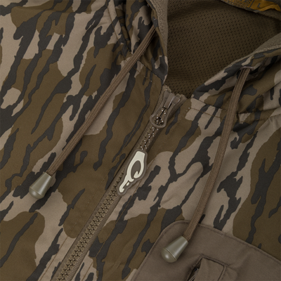 Close-up of a brown and tan camouflage MST Waterproof Full Zip Jacket w/ Hood featuring a front zipper and drawstring hood.