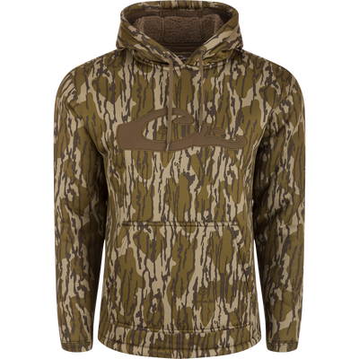 The LST Silencer Fleece-Lined Hoodie by Waterfowl in Mossy Oak Original Bottomland features a fleece lining, large front pocket, abstract dark brown logo on the chest, drawstrings, and cozy hood for warmth.