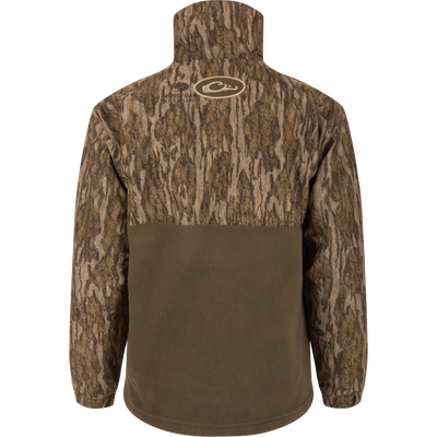 Rear view of the MST Youth Eqwader Quarter Zip Jacket, featuring a bark-style camo upper and olive-brown fleece lower back, designed for waterfowl hunting comfort.