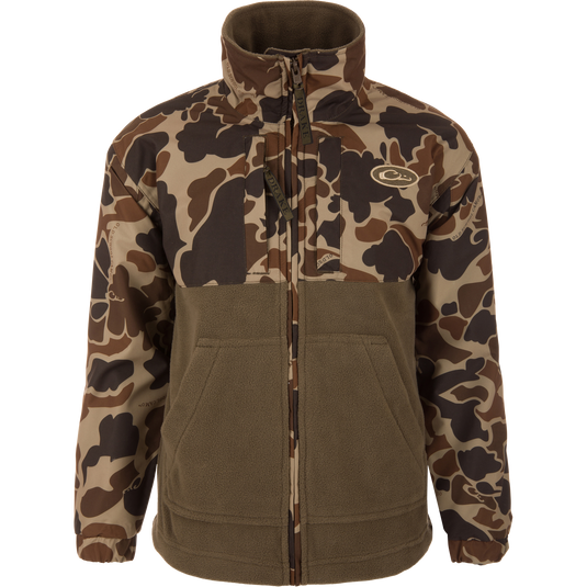 MST Youth Eqwader Full Zip Jacket featuring camo-shell upper and olive-brown fleece lower, with waterproof sleeves, high collar, and branded zipper pulls for enhanced comfort.