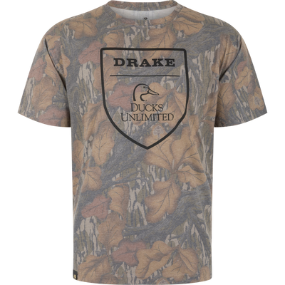 Drake X Ducks Unlimited Faded T-Shirt in a brown and tan Mossy Oak Fall Foliage camouflage print with a central shield logo featuring a duck head icon and the text Drake Ducks Unlimited.