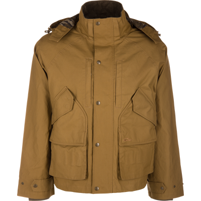 Tan MST Drake Dry Waxed Cotton Wading Jacket with a stand-up collar, detachable hood, and four large front pockets, designed for durability in outdoor conditions.